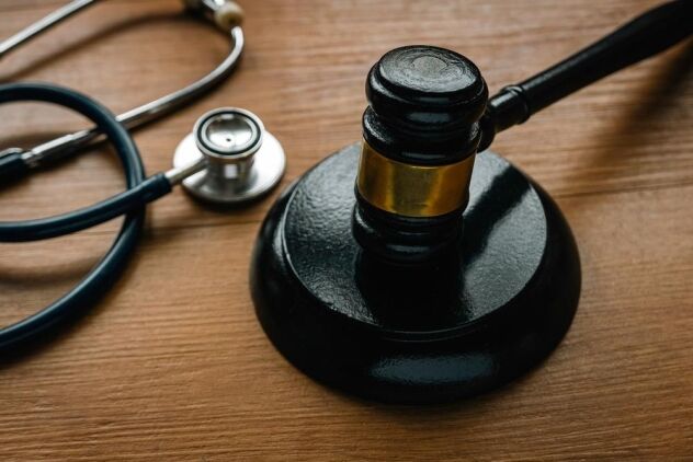 Judge’s gavel and stethoscope symbolizing the intersection of healthcare and legal accountability in Florida Baker Act cases.